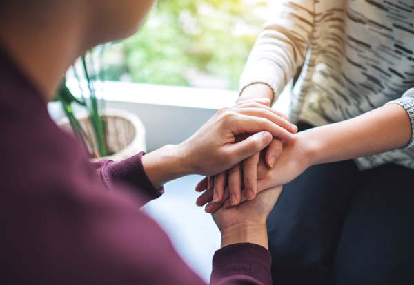 holding hands connected in support emotional connection three principles of care