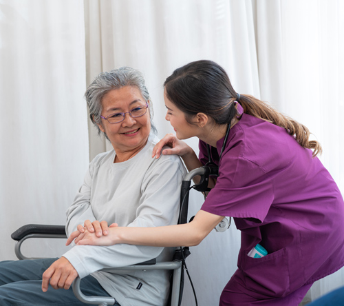 caregiver assisting elderly woman smiling together in comfortable setting enhancing two-way communication