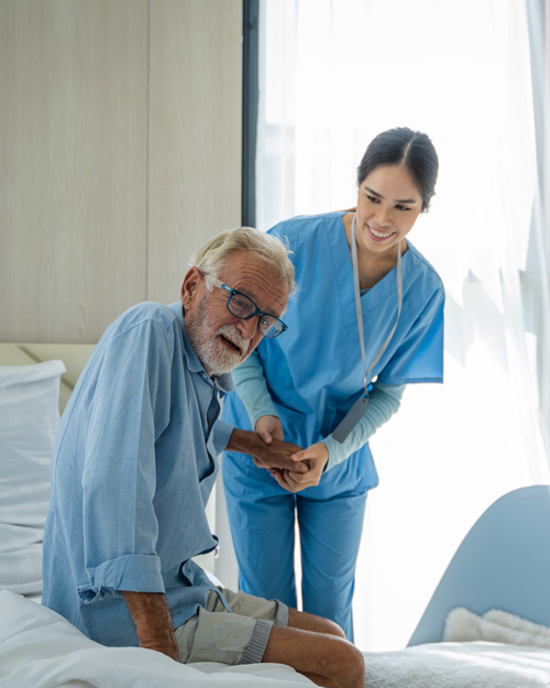 healthcare worker assisting elderly man in blue scrubs promoting wellness and care 4 support and comfort